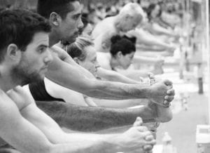 Several Guys in Standing Head to Knee Pose