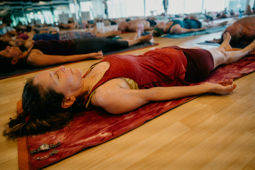 student in savasana at end of class