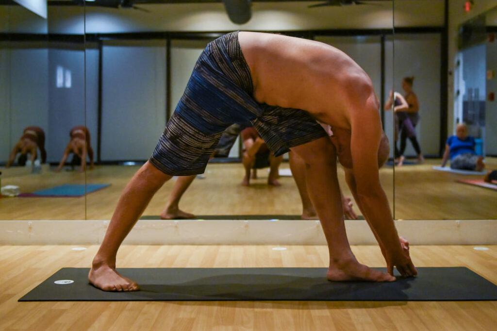 bikram yoga pose 10 standing separate head to knee